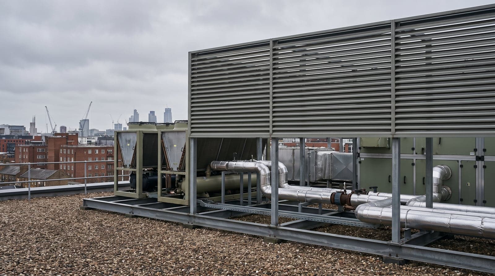 The plant deck of an office building: chillers and air handling units behind louvred screening