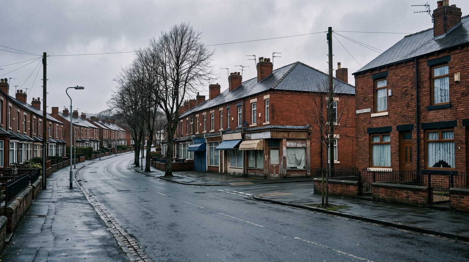 A northern English street corner of red-brick terraces, a small parade of shops and street trees