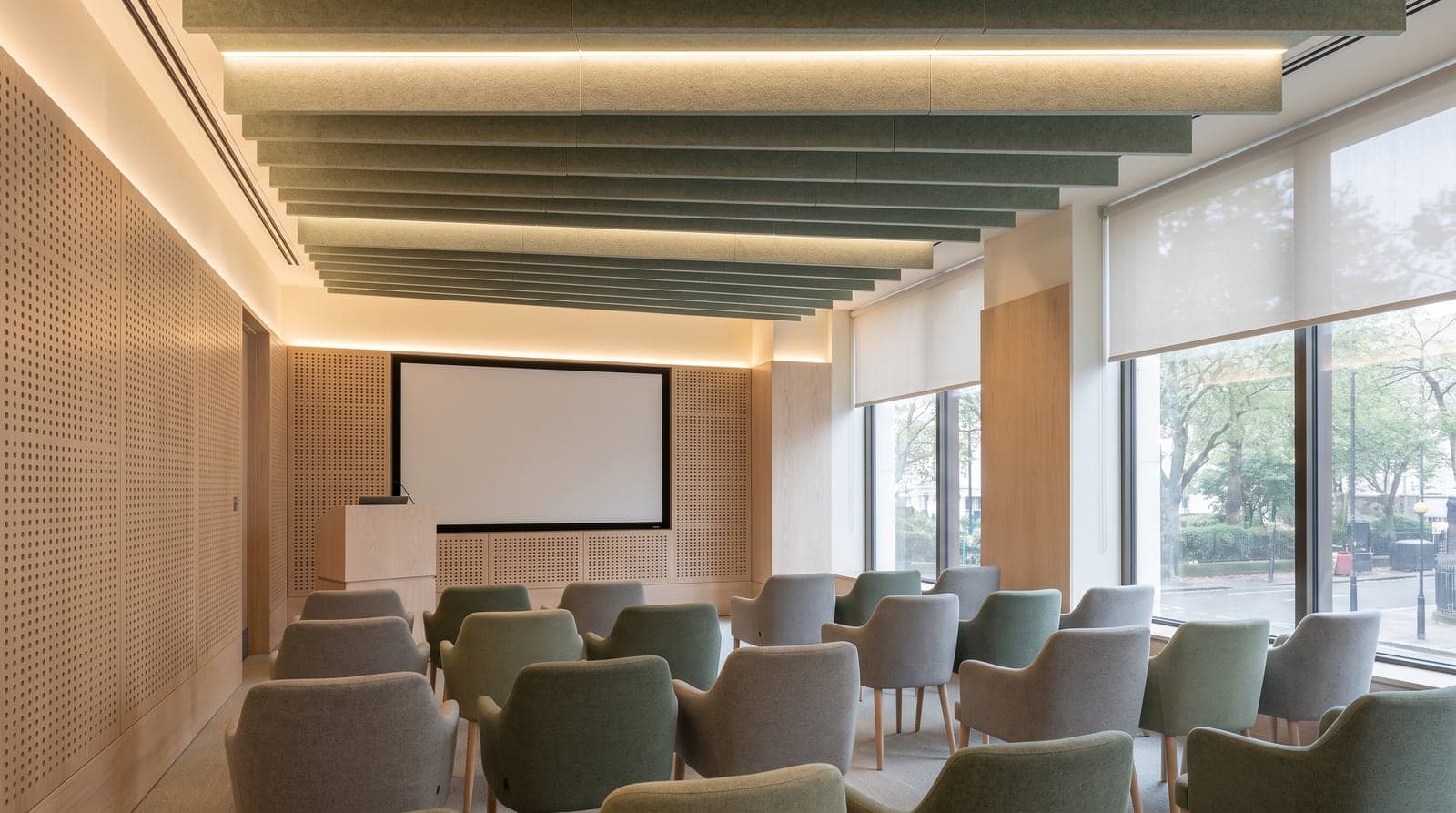 An acoustically treated interior with exposed services and absorptive finishes